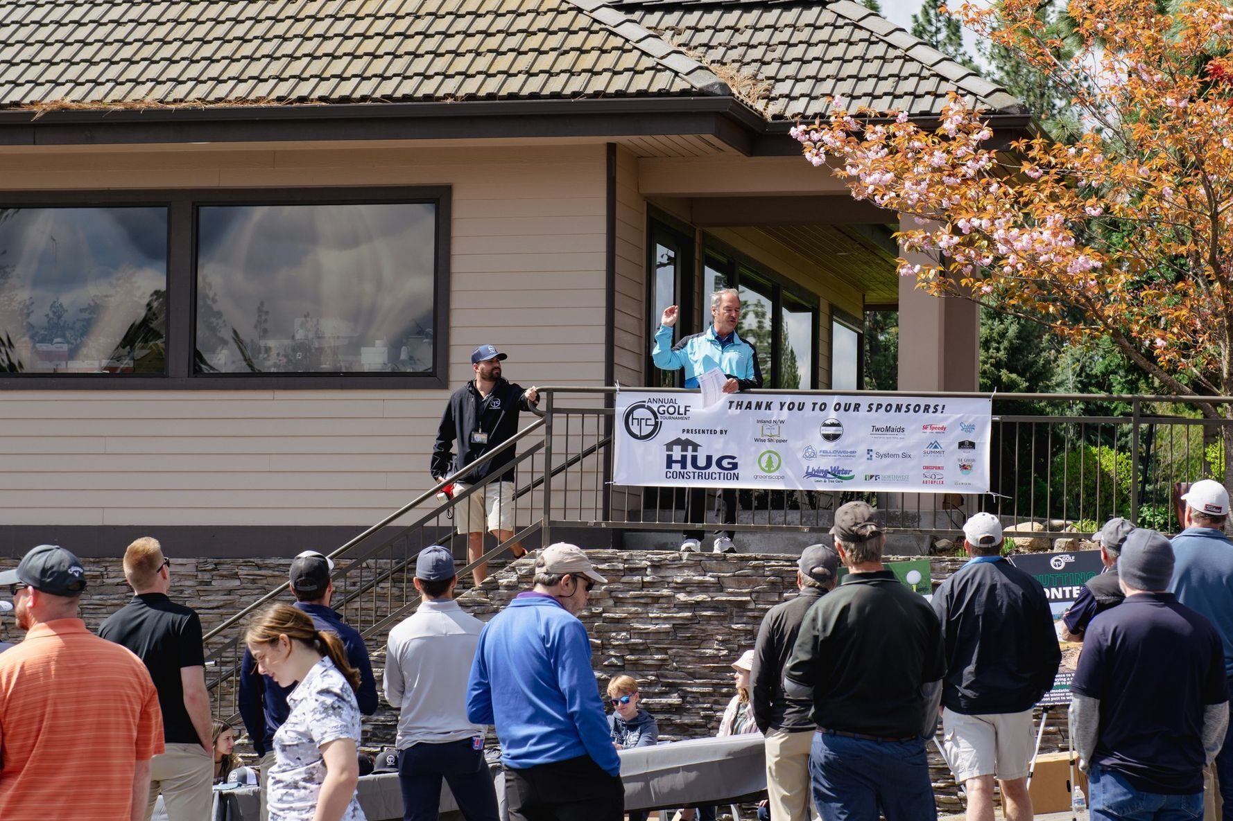 A photo of an Annual Golf Tournament, sponsored by Hug Construction.