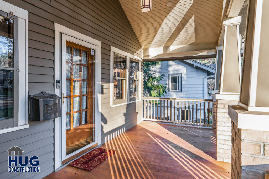 New porch remodel. Exterior photo of remodeled covered porch area.