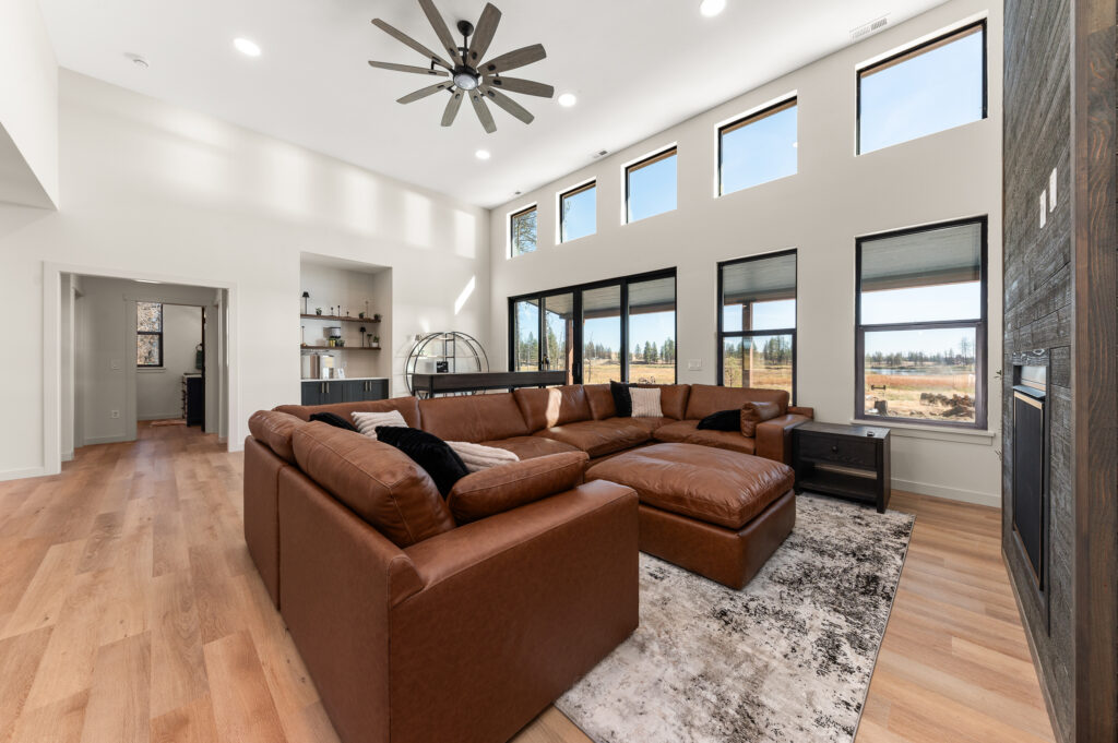 2024 People's Choice Award Winner. Living room and wall of windows.