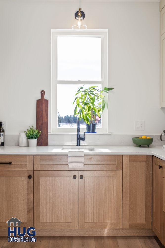 Interior photo of pantry with window and sink.