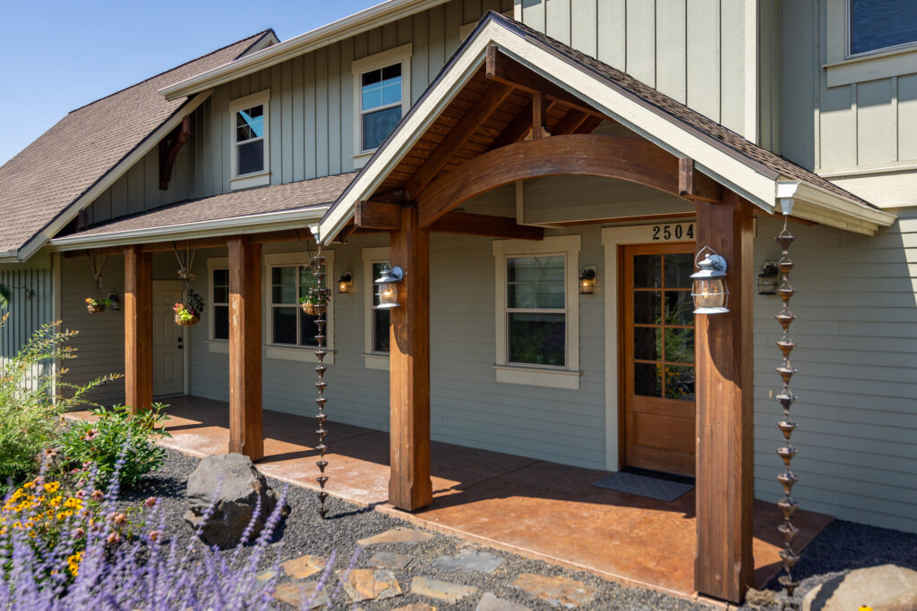 Smythe Road. Custom Home. Exterior photo of covered porch and entrance to home.