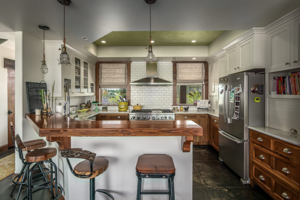 Smythe Road. Custom Home. Interior photo of the kitchen and island seating.