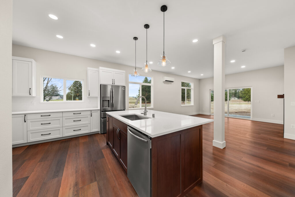 ADU-78. Interior photo of kitchen island with sink and dishwasher.