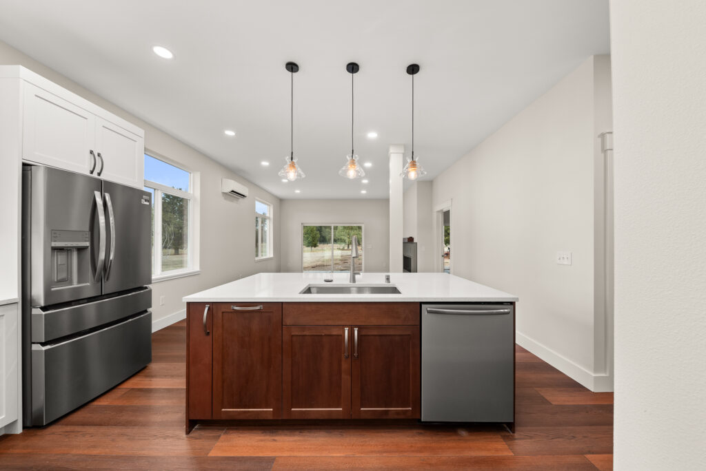 ADU-78. Interior photo of kitchen island with sink and dishwasher.