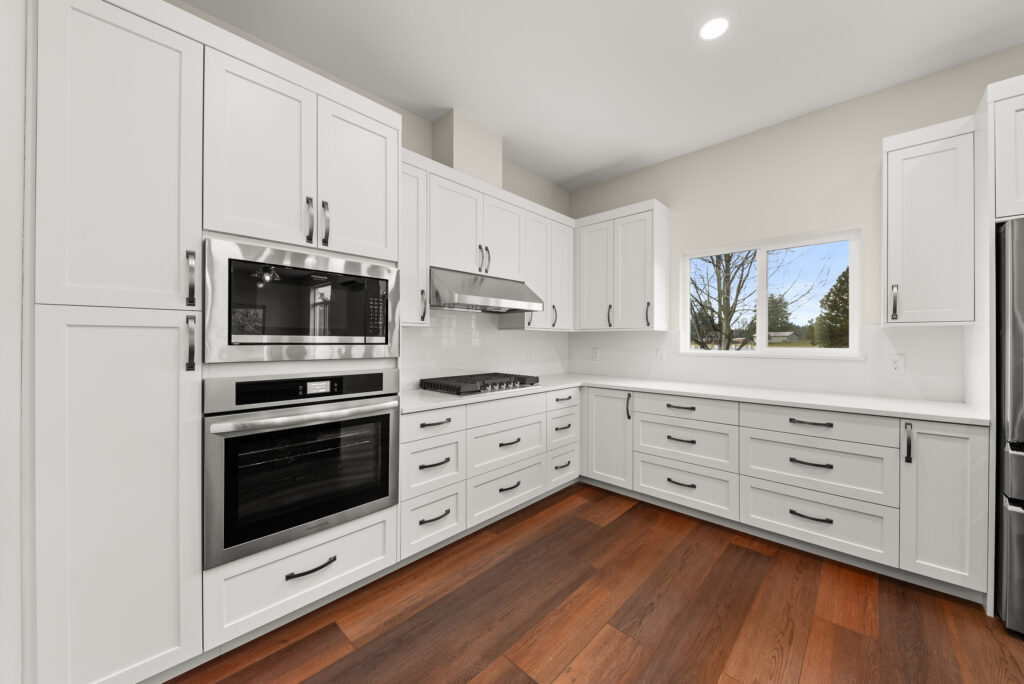 ADU-78. Interior photo of kitchen island with ovens and stovetop.