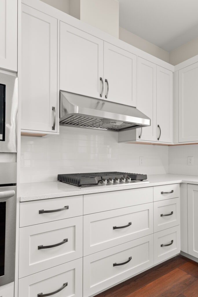 ADU-78. Interior photo of kitchen island with stovetop and range hood.