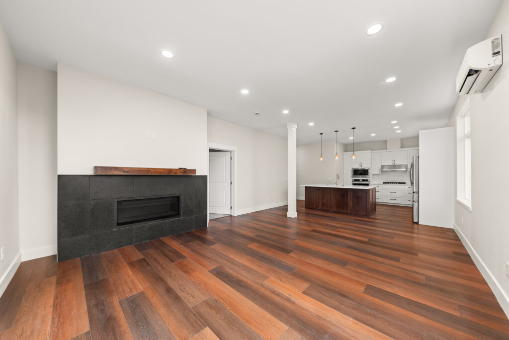 ADU-78. Interior photo of living room area with fireplace.