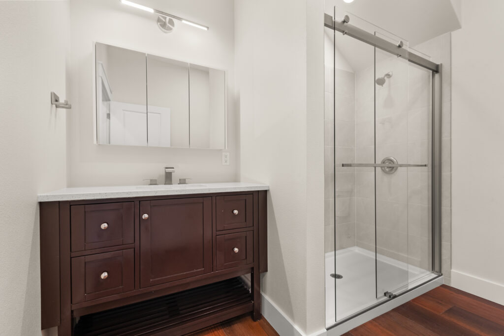 ADU-78. Interior photo of bathroom with vanity and shower.