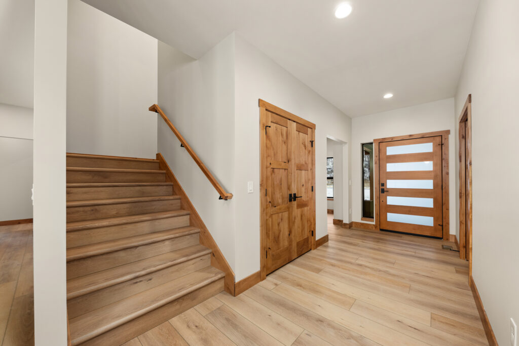 Alderwood. Interior photo of the stairway custom waterfront home.