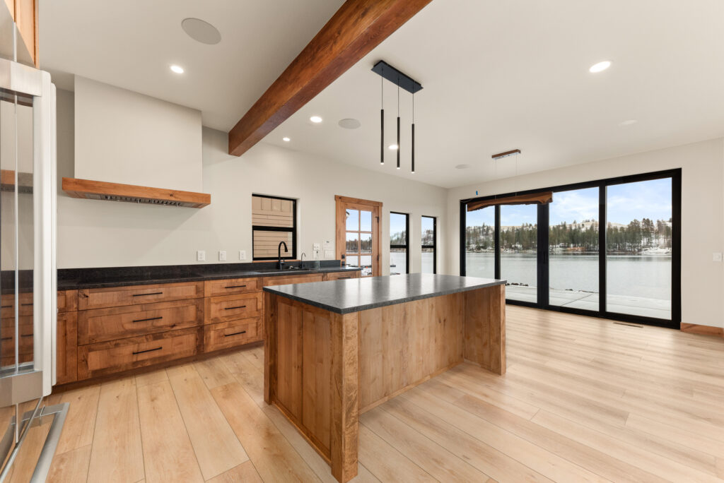 Interior photo of the kitchen island with modern lighting fixture.