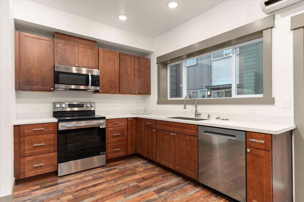 Commercial-88. Multi-Family Dwelling. Interior photo of kitchen oven and dishwasher.