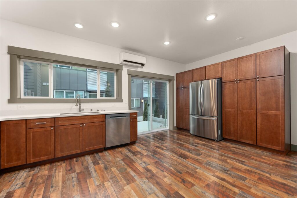 Commercial-88. Multi-Family Dwelling. Interior photo of kitchen dishwasher and refrigerator.