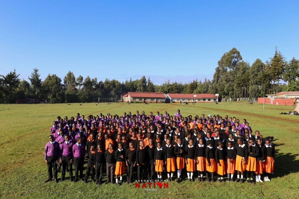 Giving. A photo of students of the Heroes of the Nation program.