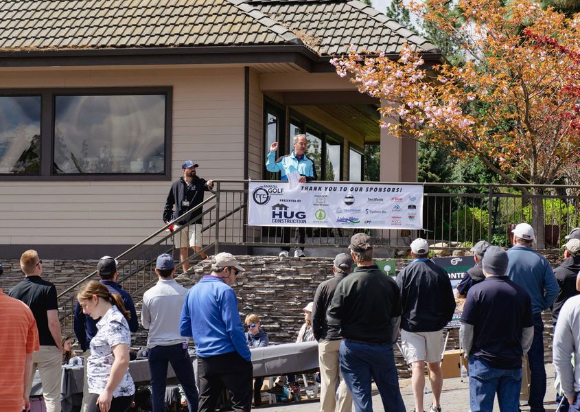 Giving. A photo showing Hug Construction at a fundraiser golf tournament.