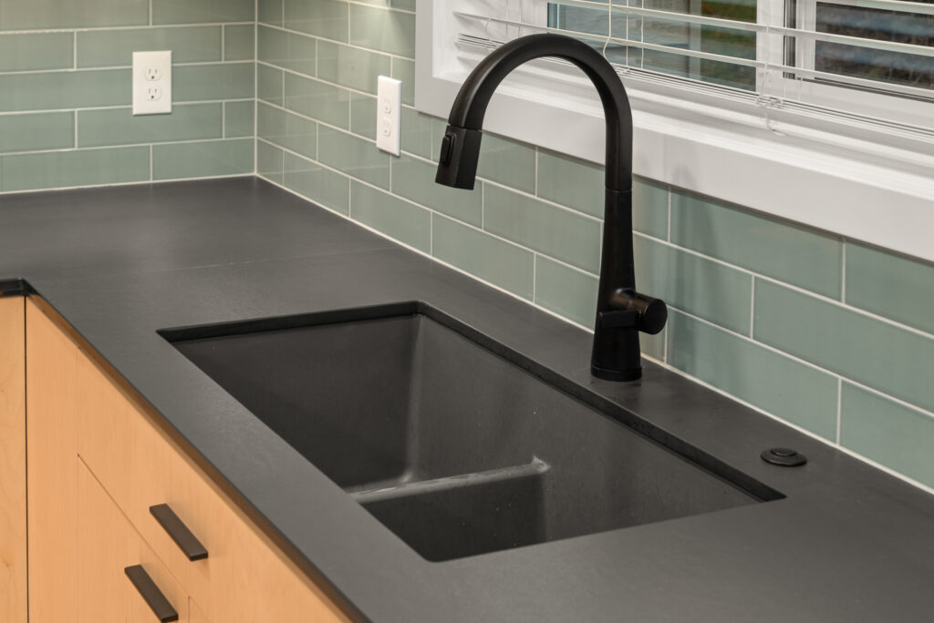 Interior image of kitchen sink and faucet fixture.