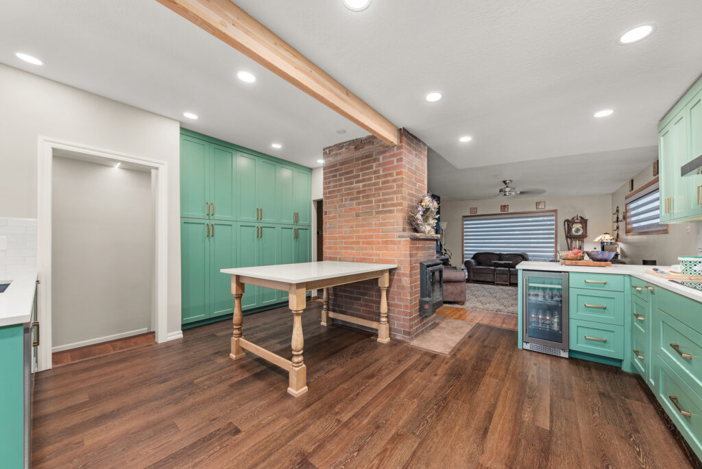 Interior photo of kitchen and table.