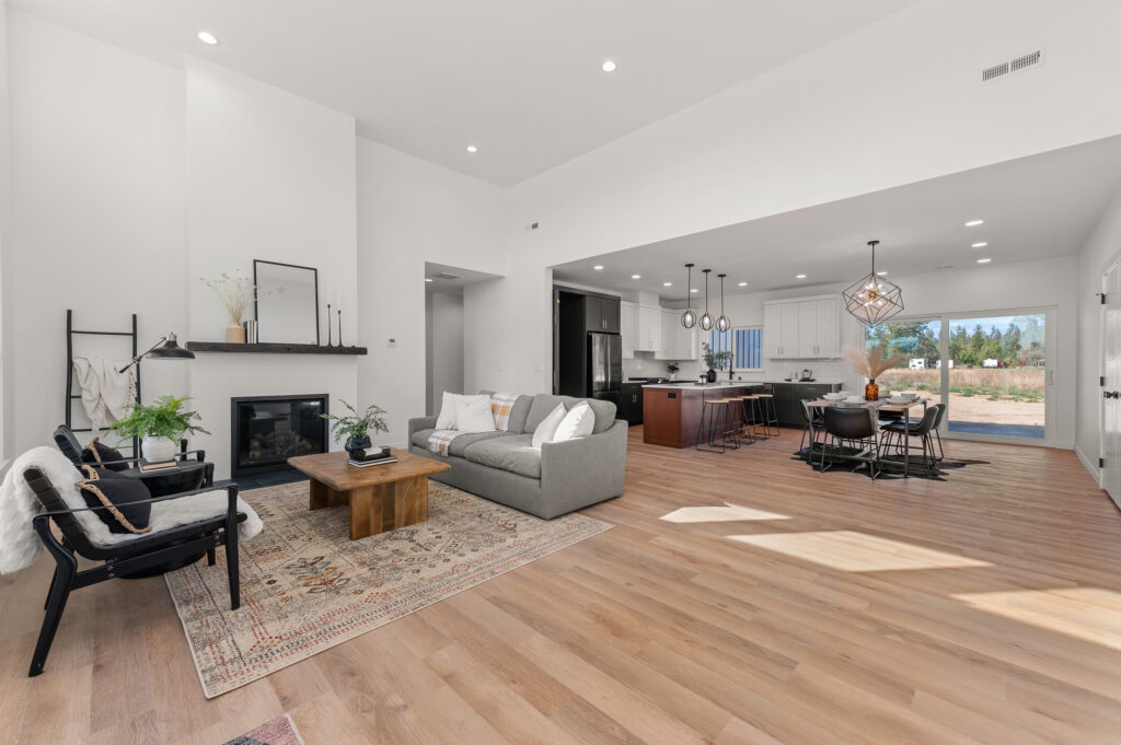 Wide interior shot of the living room and kitchen area.