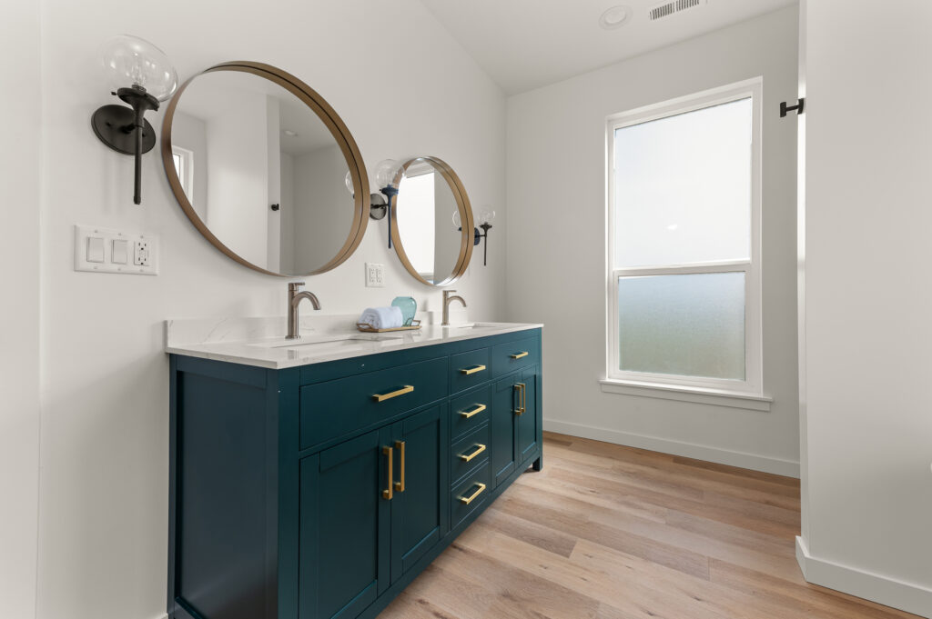 Interior shot of a bathroom with vanity and sink.