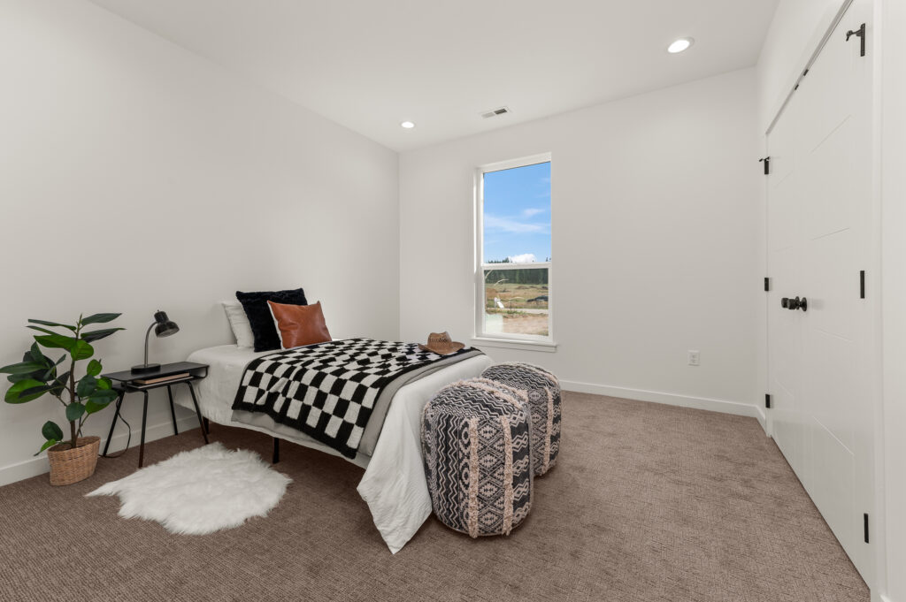 Loon Lake. Interior shot of a bed in a bedroom.