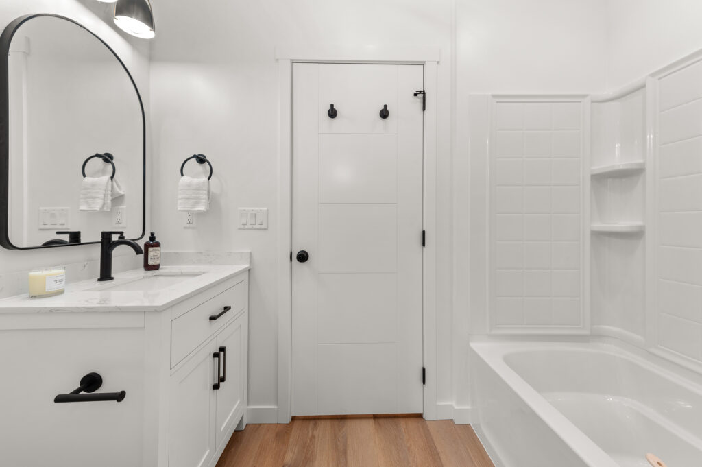 Interior shot of a bathroom with tub.