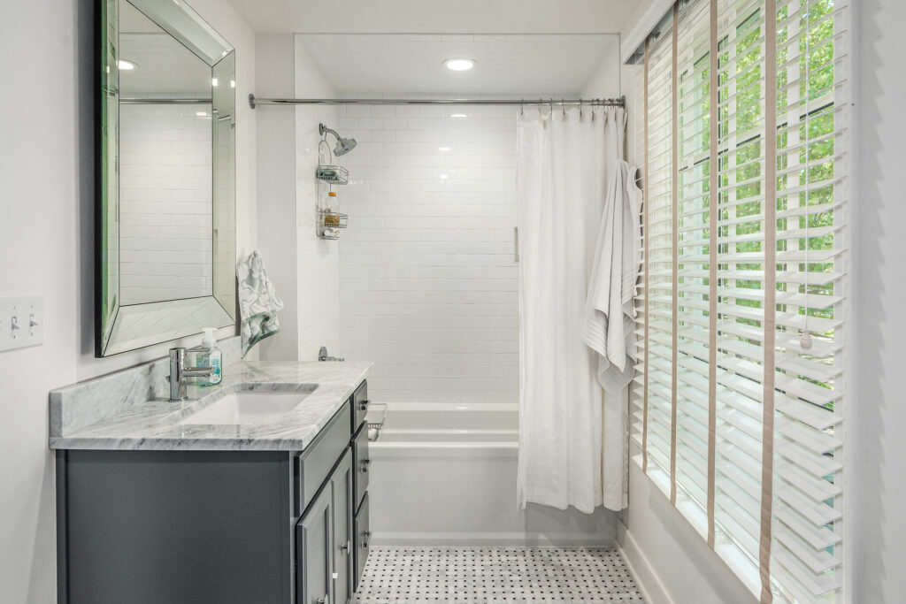 Full Home Remodel. Interior shot of bathroom vanity and tub.