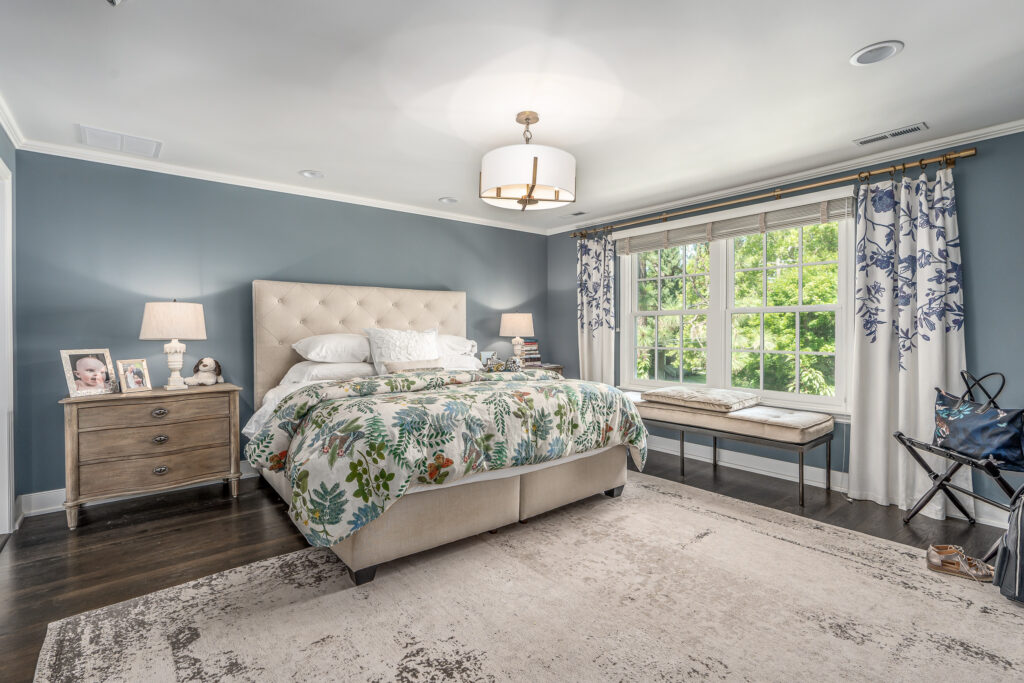 Full Home Remodel. Interior shot of bed in bedroom.