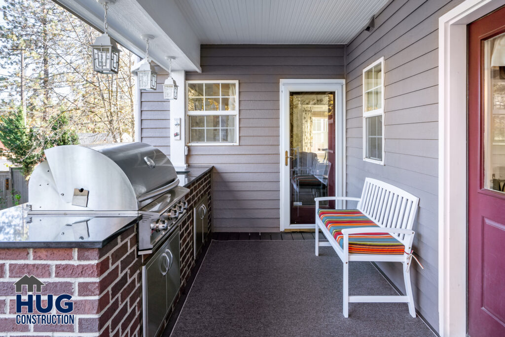 West 20th Deck Remodel. Exterior shot of deck and outdoor seating and grill.