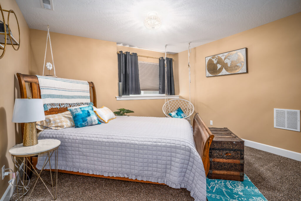 Basement Remodel. Interior photo of bed in bedroom.