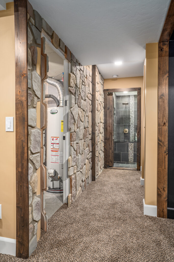 Basement Remodel. Interior photo of hallway in stone.