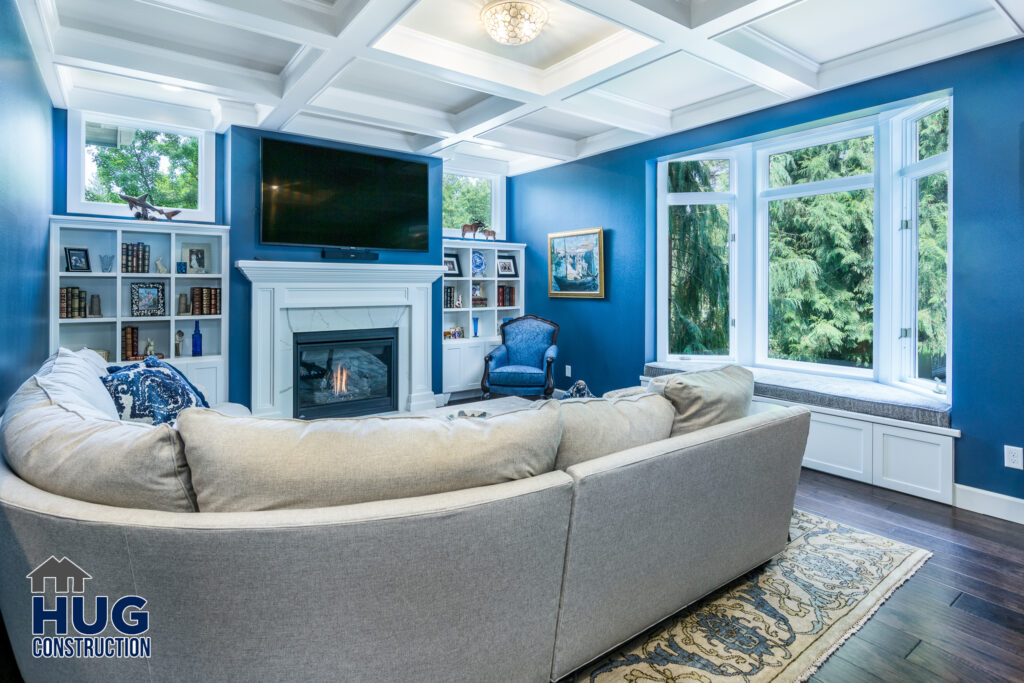 Living Room Remodel. Interior photo of built-in bookcase, fireplace and sitting area.