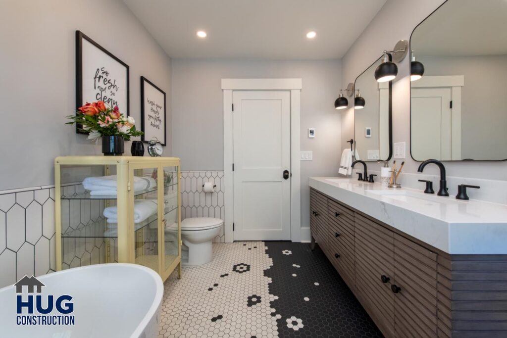 Bathroom Remodel. Interior photo of the double vanity, soaking tub, and unique floor tile pattern.