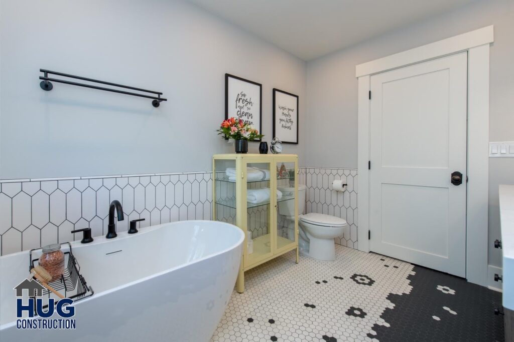 21st Ave Bathroom Remodel. Interior photo of the soaking tub and unique floor tile pattern.