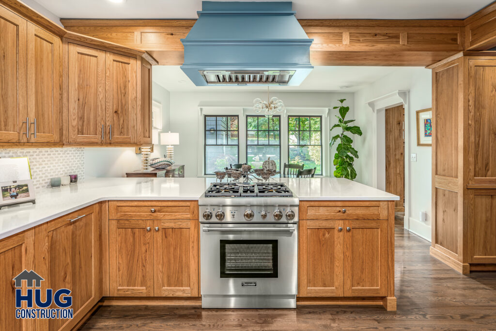 22nd Ave Kitchen and Bathroom Remodel. Interior photo of kitchen with stainless steel oven and range hood.