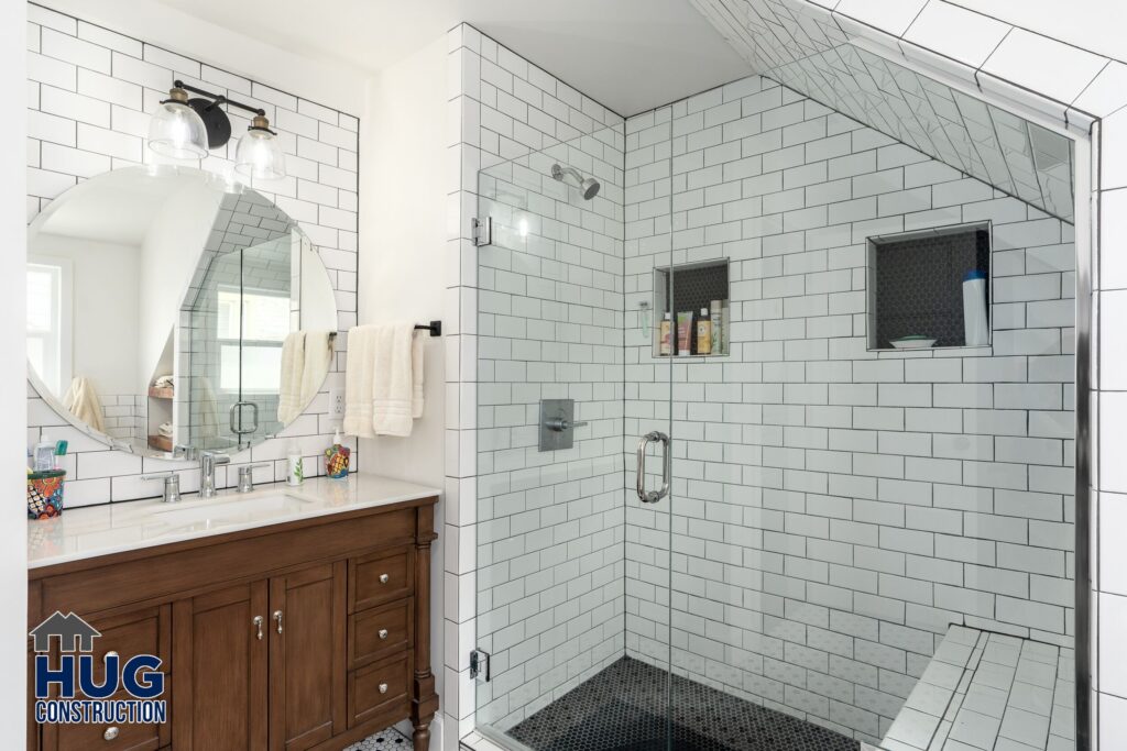 Broadway Upstairs Remodel. Image of a bathroom with vanity and shower.