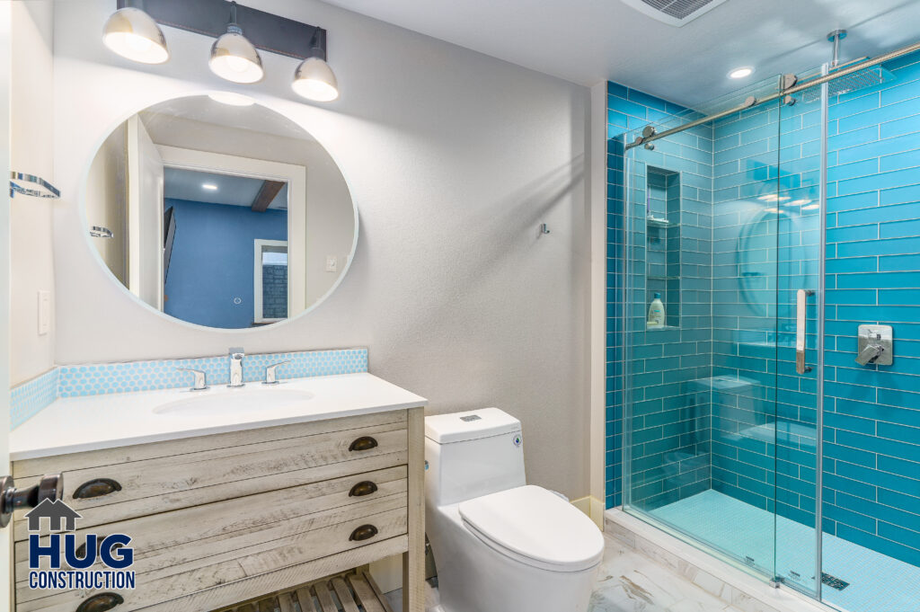 Osprey Heights Basement Finish project. Bathroom with vanity and shower.