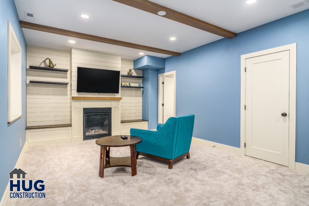 Osprey Heights Basement Finish project. Living room and fireplace.