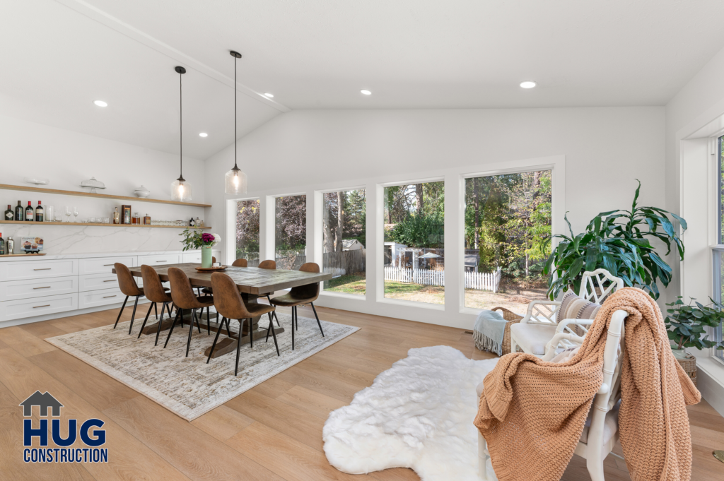 South Pittsburg Addition and Kitchen Remodel. Interior photo of the dining area with large windows.