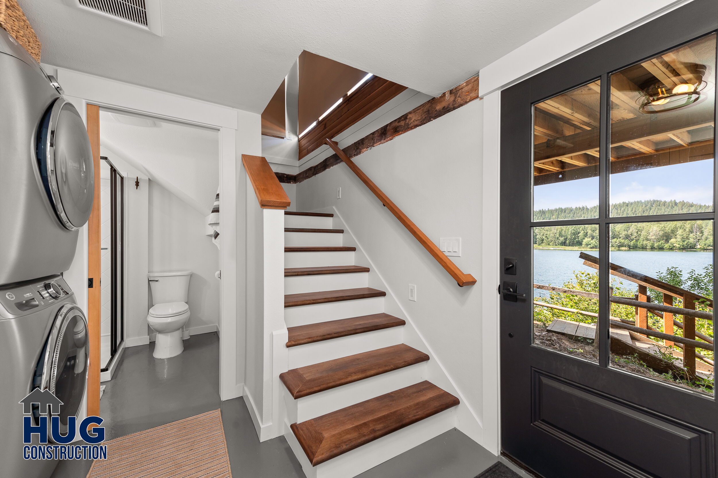 Remodel and New Deck. Interior photo of laundry area, bathroom and stairs.