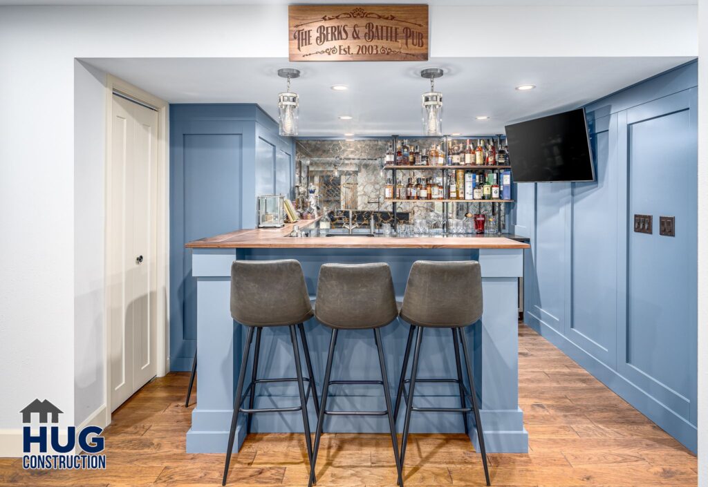 South Ridge Court Basement Bar. Interior photo of the wet bar with seating.