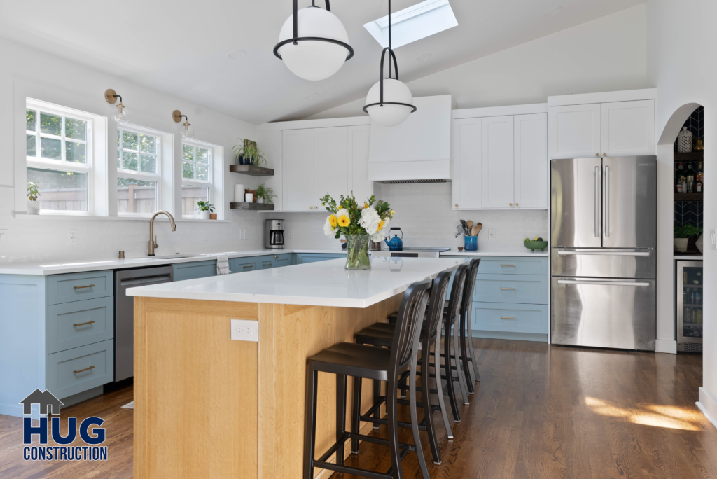 18th Ave. Image of kitchen appliances and island seating area.