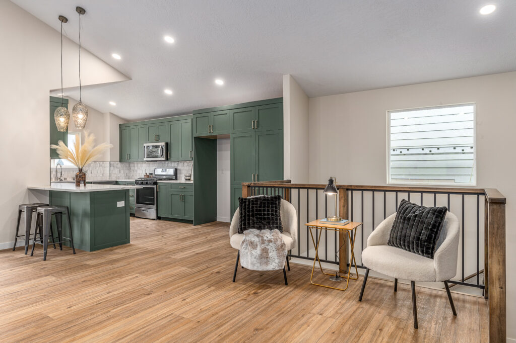 West Cora Avenue Custom Residential Home. Interior photo of a kitchen with appliances and seating area.