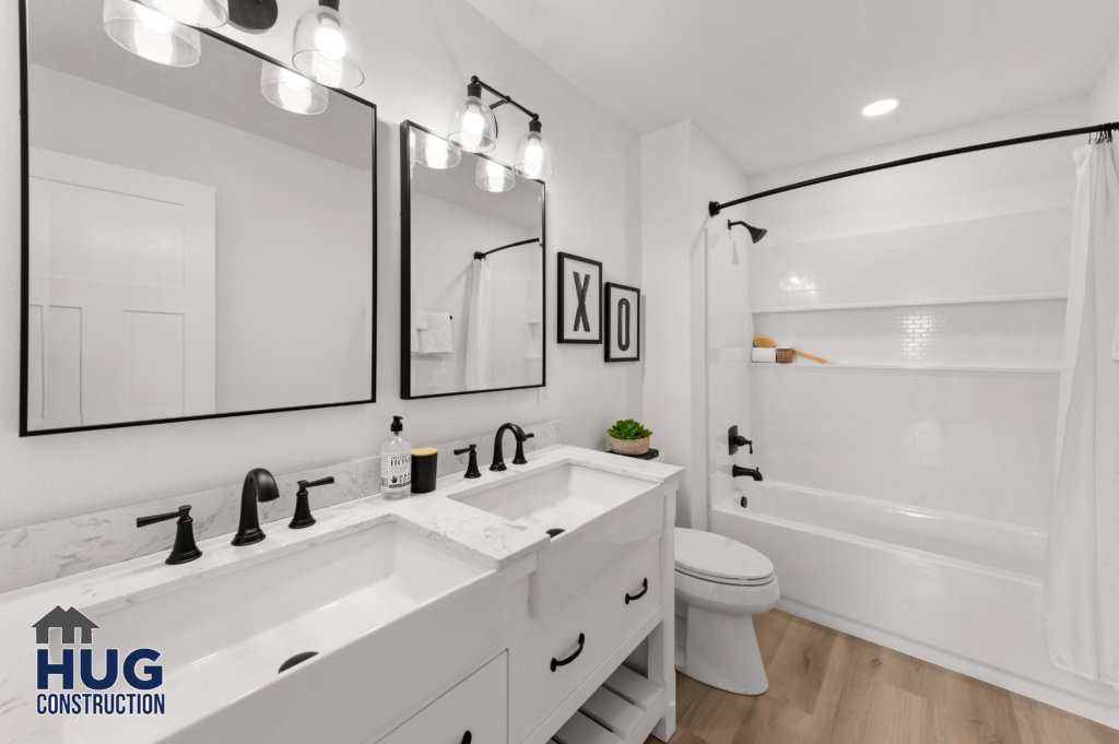 Custom Residential Home. Interior photo of a bathroom with double vanity and tub.