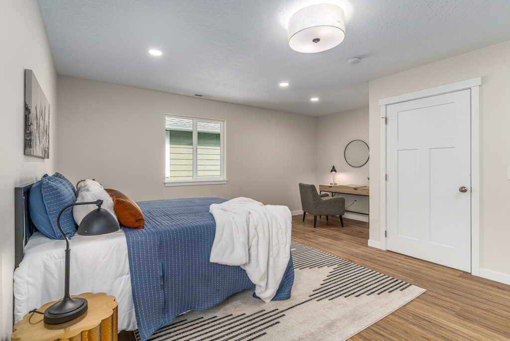 West Cora Avenue Custom Residential Home. Interior photo of a bed in a bedroom.